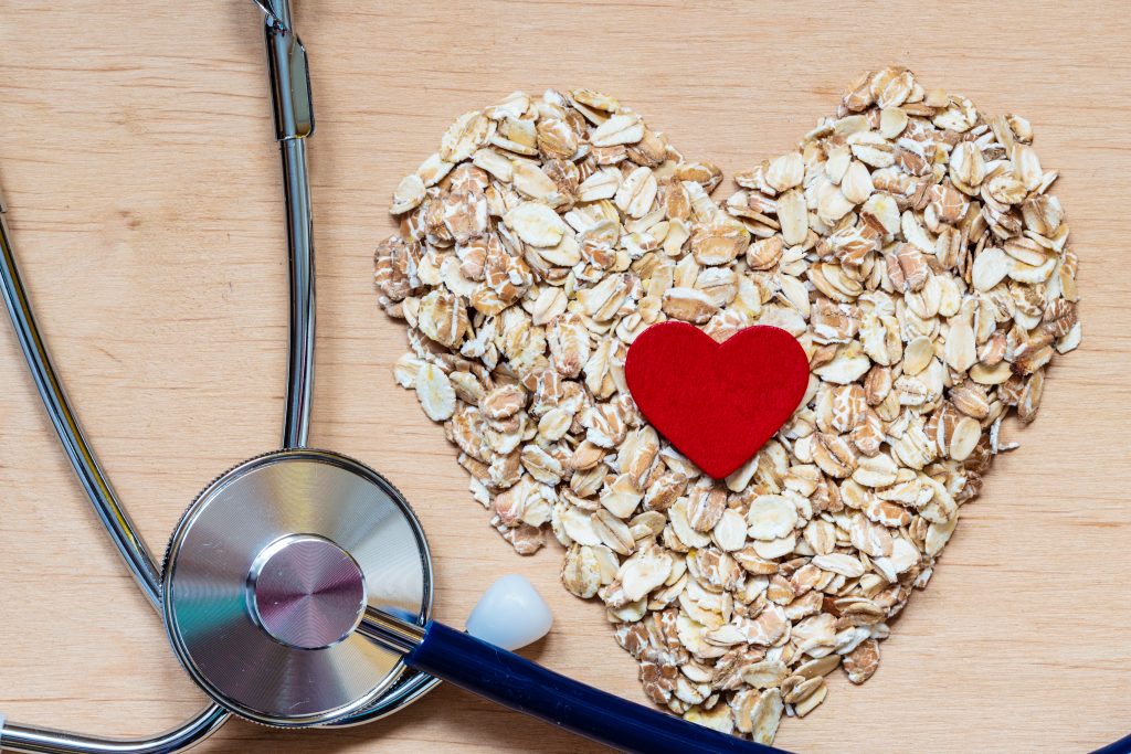 Oat flakes heart shaped and stethoscope.
